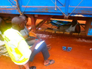 North Star Alliance project manager, Samba Touray, interviewing truck drivers in West Africa.